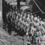 Communist soldiers marching through gates of the Great Wall ~ No. 1 (Kalgan, China, April 1946)